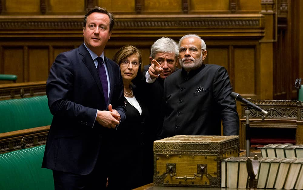 Britain's Speaker of the House of Commons John Bercow gestures standing behind the dispatch box as he, British Prime Minister David Cameron and Speaker House of Lords Baroness D'Souza, accompany Indian Prime Minister Narendra Modi on a tour of The Commons Chamber inside the Houses of Parliament in central London.