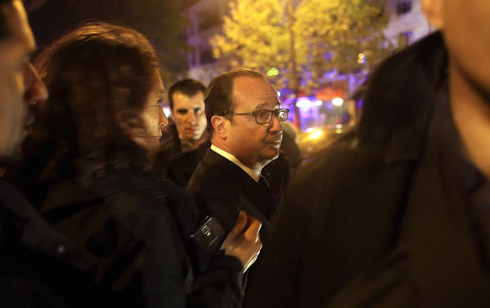 French President Francois Hollande arrives to visit the site of the the Bataclan theater after a shooting in Paris.