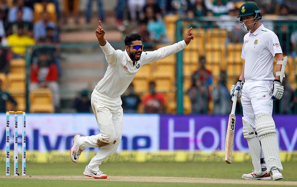 Ravindra Jadeja celebrates the dismissal of South Africa's Kagiso Rabada during the first day of their second cricket test match in Bangalore.