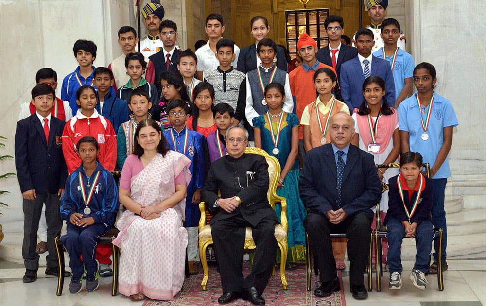 President Pranab Mukherjee, Union Women & Child Development Minister Maneka Gandhi posing with receipients of National Child Awards for Exceptional Achievements for 2014 on the occasion of Children’s Day at Rashtrapati Bhavan in New Delhi.