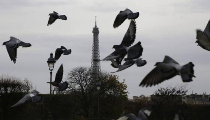 Eiffel Tower goes dark as France mourns over 120 dead