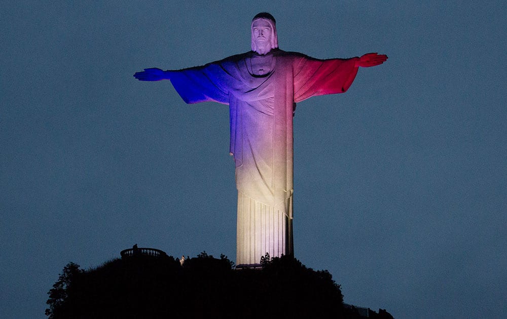 Christ the Redeemer statue is lit with the colors of France's flag, in solidarity with France after attacks in Paris, in Rio de Janeiro, Brazil.
