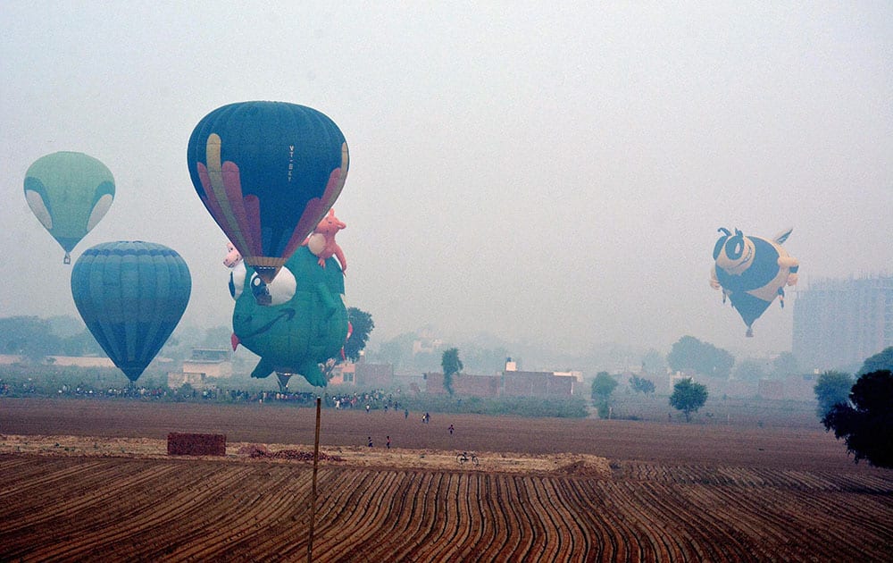 Huge balloons flying in the air during first day of the two-day balloon festiva in Agra.