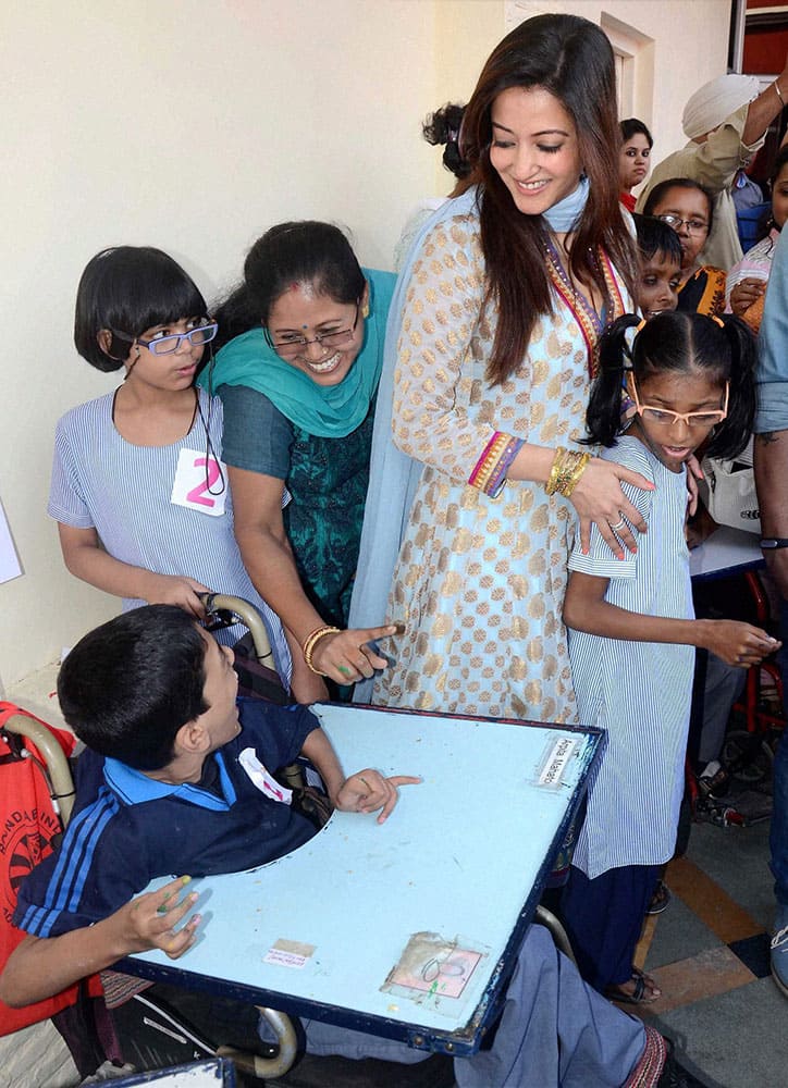 Actress Raima Sen meets with underprivileged children at an event to mark Childrens Day in Kolkata.
