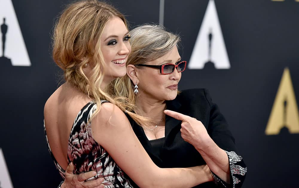 Billie Catherine Lourd, left, and Carrie Fisher arrive at the Governors Awards at the Dolby Ballroom in Los Angeles. 