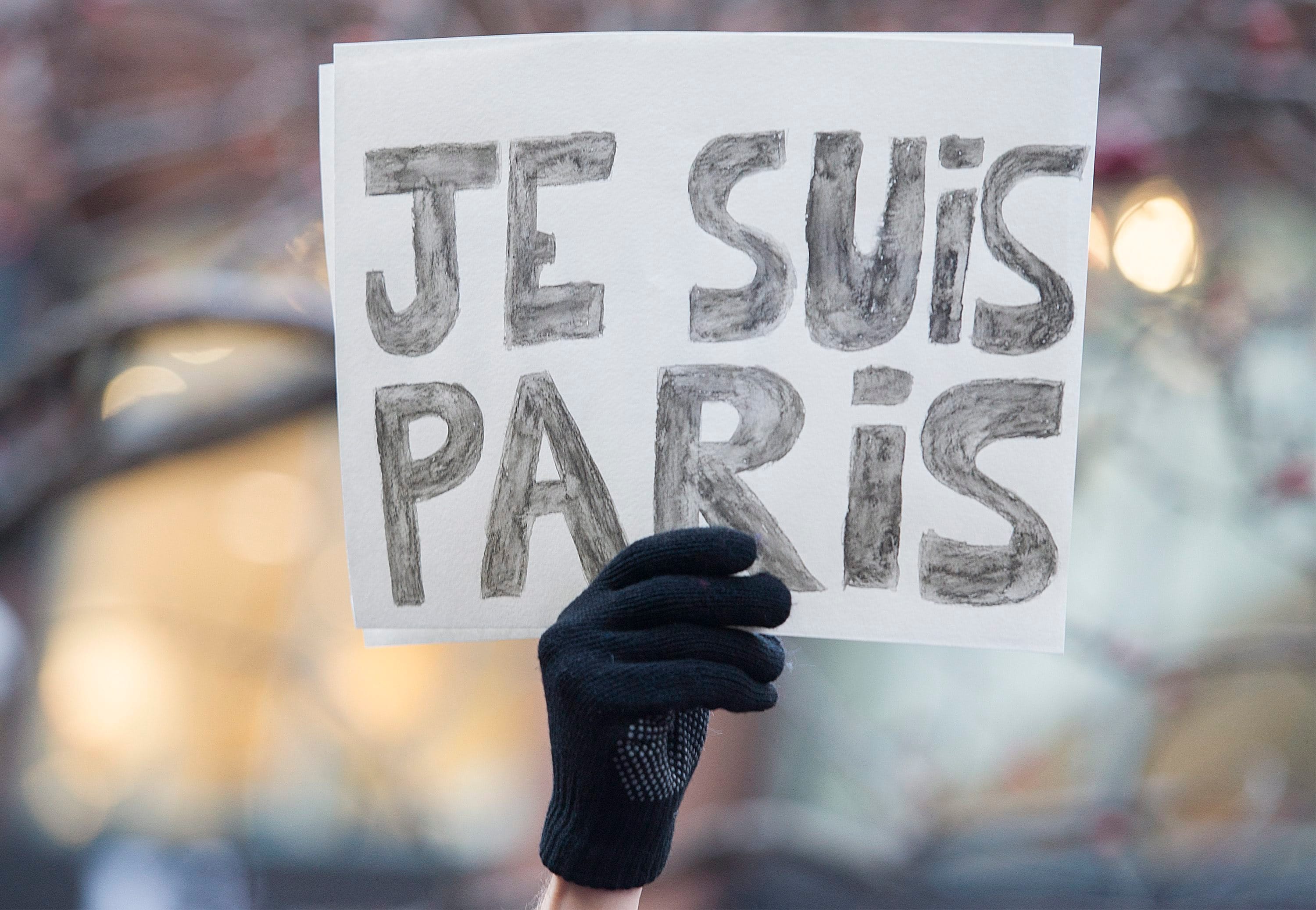 A man holds up a sign which reads, Je Suis Paris (I Am Paris) during a rally of solidarity outside the Consulate of France in Montreal, Quebec, Canada.