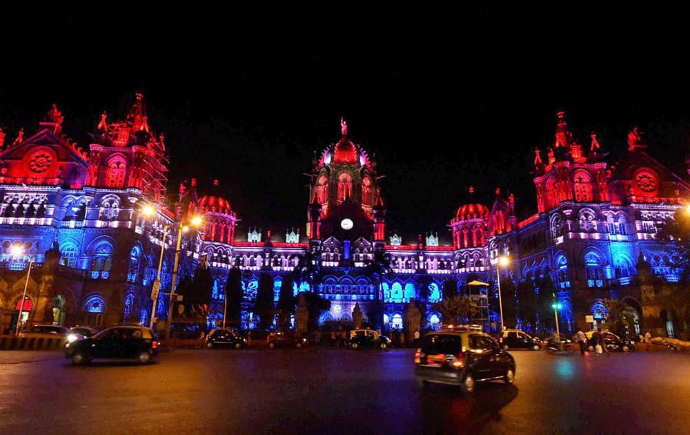 Chhatrapati Shivaji Terminus (CST) heritage building lit up in the colors of the French flag in solidarity with France after the deadly attacks in Paris, in Mumbai.