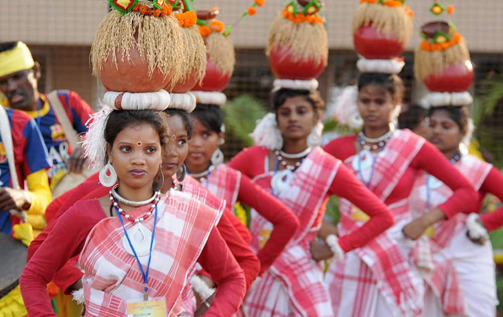 Tribal artists perform during the Jharkhands foundation day ceremony at Birsa Munda Football stadium in Ranchi.