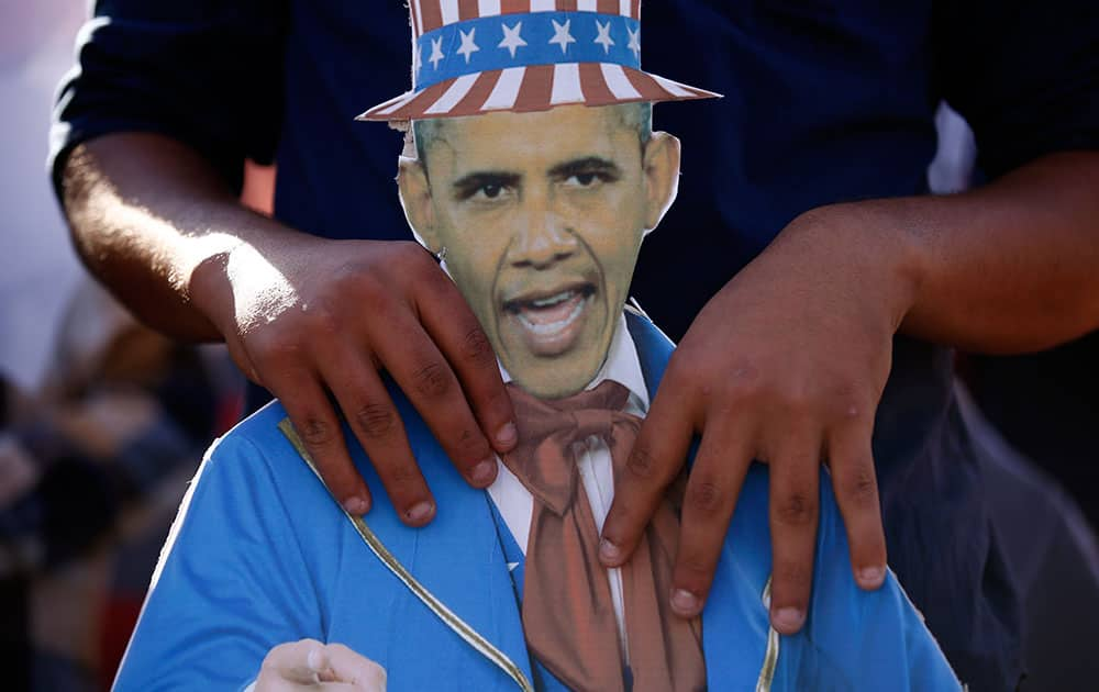 A member of Turkey Youth Union holds an effigy of U.S. President Barack Obama during an anti-G20 protest in Antalya, Turkey.