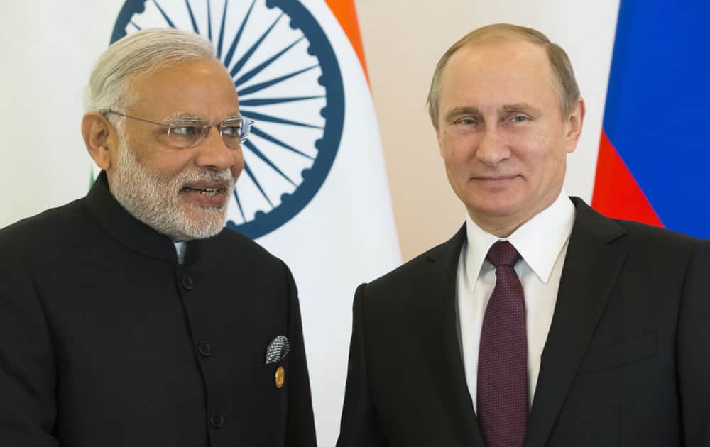 Russian President Vladimir Putin, right, and Indian Prime Minister Narendra Modi pose for photo during a meeting of leaders of BRICS prior the G-20 Summit in Antalya.