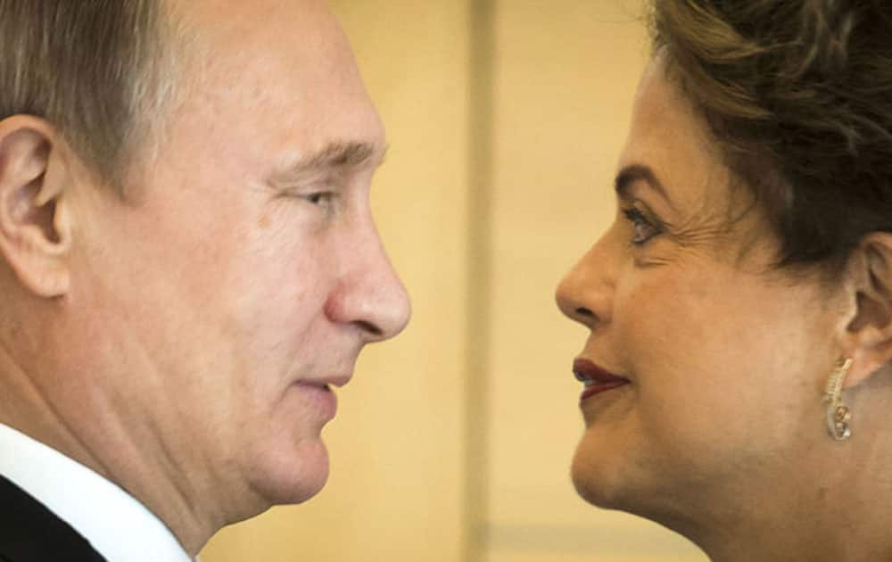 Russian President Vladimir Putin, left, shake hands with Brazilian President Dilma Rousseff during the meeting leaders of BRICS prior the G-20 Summit in Antalya.