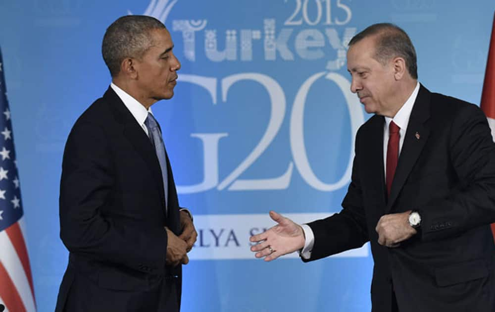 Turkey’s President Recep Tayyip Erdogan waits to shake the hand of US President Barack Obama, left, following their meeting in Antalya.