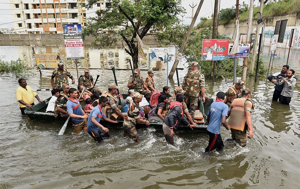 Army personnel rescuing people during their flood relief operations in rain-hit areas of Chennai.