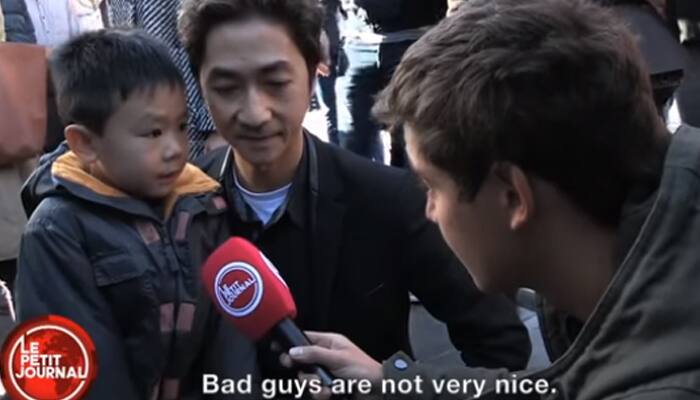 &#039;Terrorists have guns but we have flowers&#039; - Father reassures son after Paris attacks - Watch