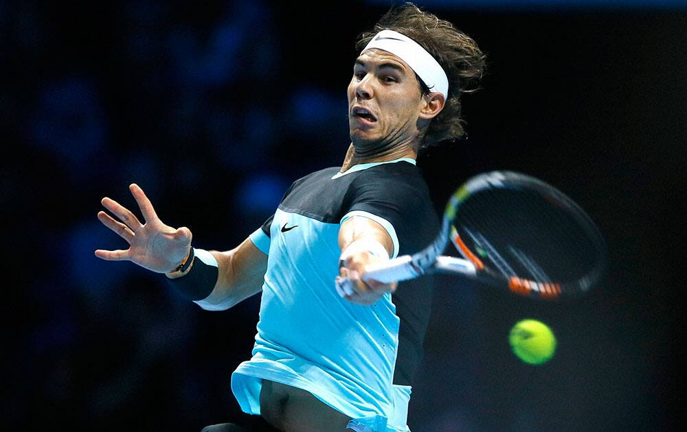 Rafael Nadal of Spain plays a return to Andy Murray of Britain during their singles tennis match at the ATP World Tour Finals at the O2 Arena in London.