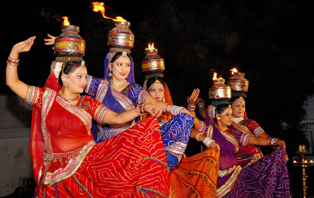 Artists perform folk dance during Mangal Milan Samaroh, at Delhi Vidhan Sabha in New Delhi.