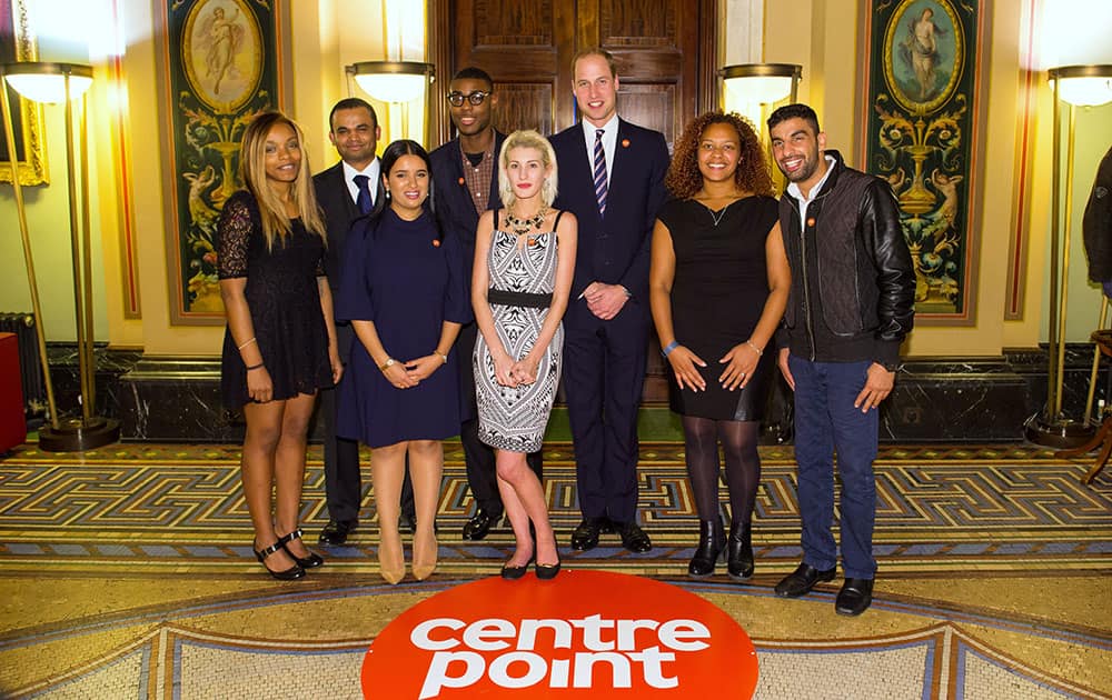 Prince William, the Duke of Cambridge, 3rd right, talks to award winners, from left, Monique Newton, Othman Ali, Sophia Kichou, Alex Bonnick, Rebecca Stephenson, Sade Brown and Ezat Gulzaman at the launch of the Centrepoint Awards at a bank in London.