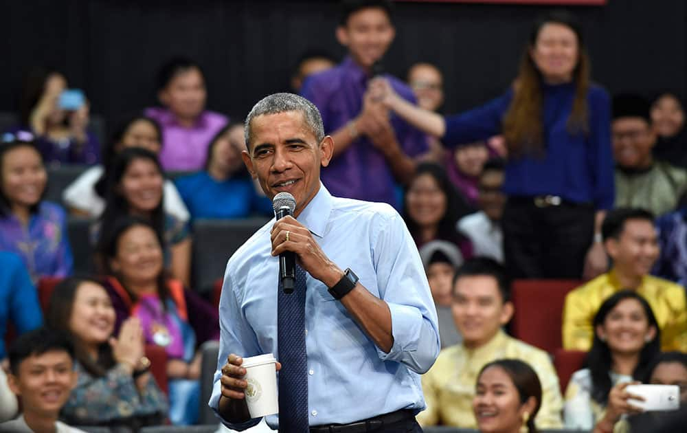 President Barack Obama laughs as he was called 'old' as he was asked a question, by the man center in purple, during the Young Southeast Asian Leaders Initiative (YSEALI) town hall at Taylor's University in Kuala Lumpur, Malaysia.