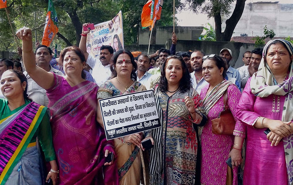 BJP workers stage protest against Delhi government at Delhi Assembly in New Delhi.
