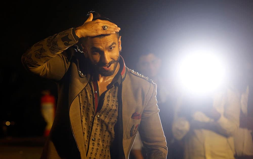 Bollywood actor Ranveer Singh dances during the trailer launch of his movie 'Bajirao Mastani' in Mumbai.