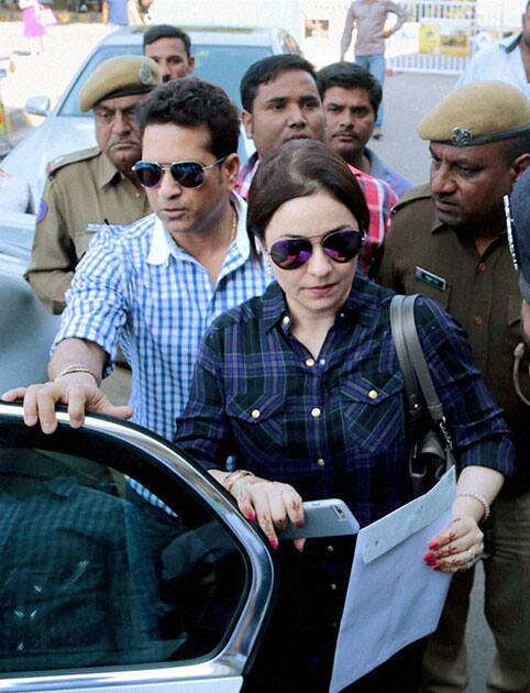 Cricket legend Sachin Tendulkar with his wife Anjali at the airport in Jodhpur on Saturday before their departure.