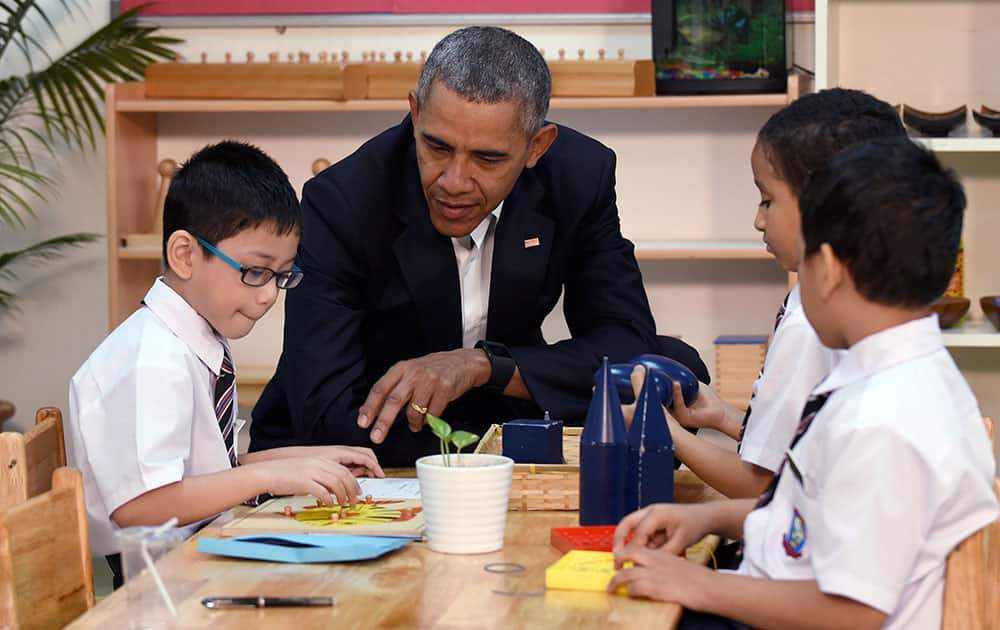 President Barack Obama meets with children as he tours the Dignity for Children Foundation in Kuala Lumpur, Malaysia.