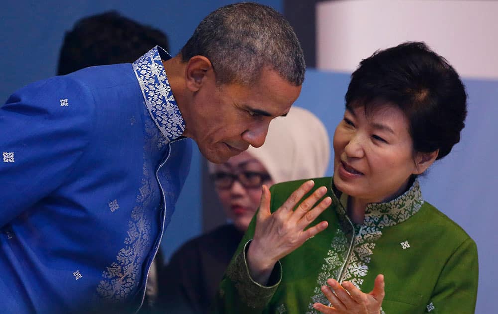 U.S. President Barack Obama, left, listen to South Korean President Park Geun-hye before the start of Gala Dinner during the ASEAN Summit in Kuala Lumpur, Malaysia.