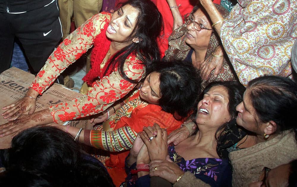 Relatives of newly married couple Arjun Singh Chib and his wife Vandna Chib mourns as they killed after an Helicopter crash at Katra, in Jammu.