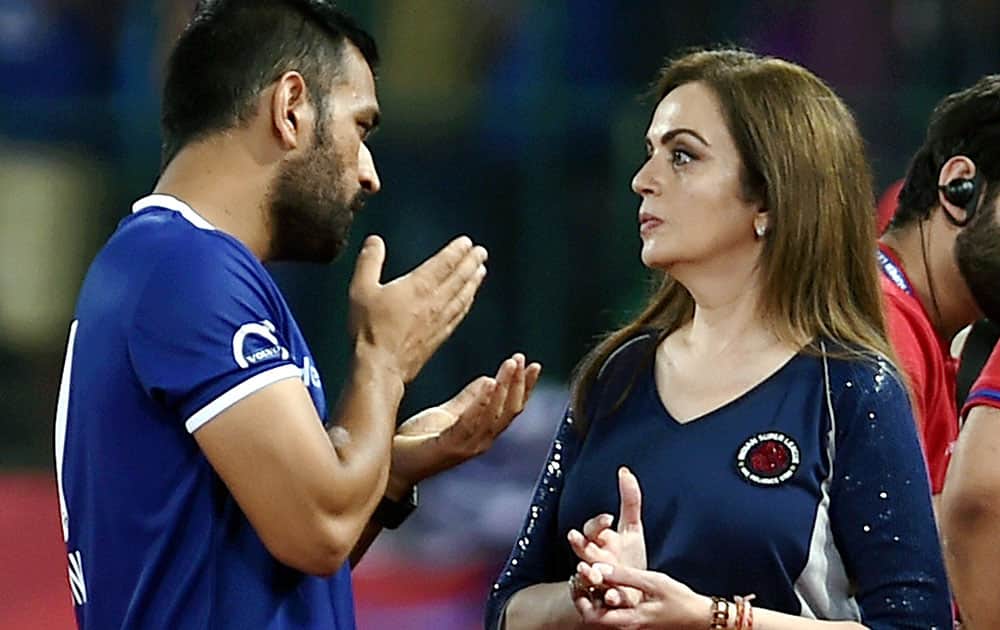 Indian Cricketer MS Dhoni and ISL Chairperson Nita Ambani during the Indian Super League (ISL) match between Chennaiyin FC and Delhi Dynamos FC at Jawaharlal Nehru Stadium in Chennai.