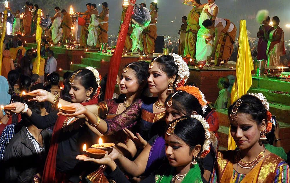People light candles on the bank of river Ganga to celebrate Dev Diwali festival on the occasion of Kartik Poornima festival in Allahabad.