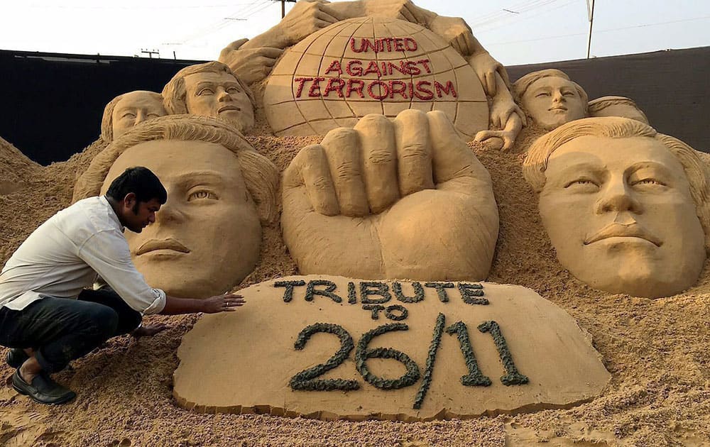 Sand artist Sudarsan Pattnaik pay tribute to 26/11 victims of Mumbai terrorist attack through his sand sculpture with message United against Terrorism at Cuttack in Odisha.
