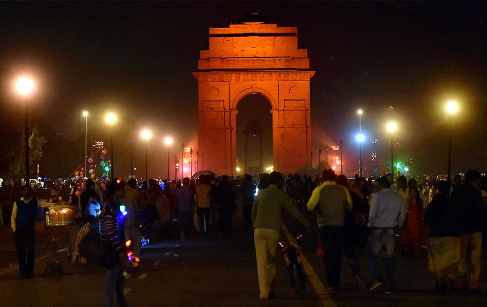 India Gate is illuminates in orange to raise awareness on ending violence against women in New Delhi.