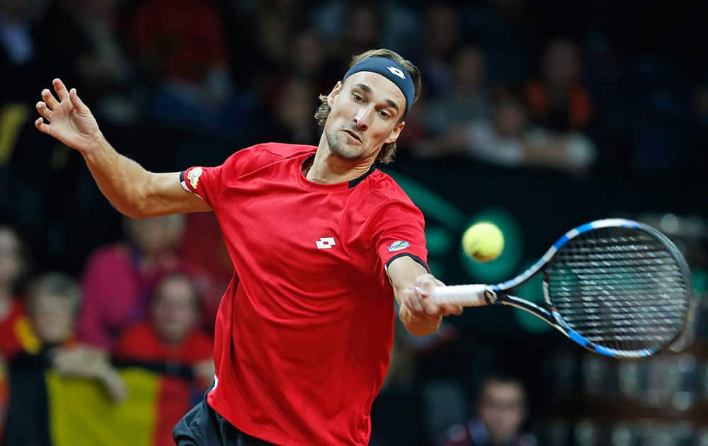 Belgium’s Ruben Bemelmans returns against Britains Andy Murray during their Davis Cup final tennis match at the Flanders Expo in Ghent, Belgium.