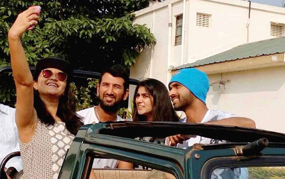 Cricketers Ajinkya Rahane and Cheteshwar Pujara with their wives taking a selfie as they leave for Tadoba National park Tiger Reserve in Chandrapur, Maharashtra.