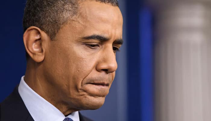 Obama visits Paris attack site, pays tribute to victims