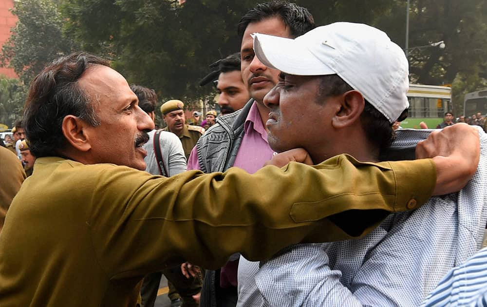 Police detain Youth Congress activists during a protest over intolerance issue at Jantar Mantar in New Delhi.