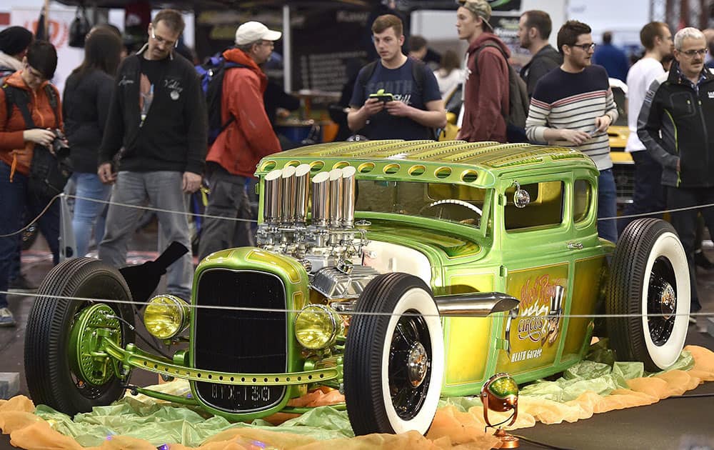 Visitors marvel at a custom-built Ford A Coupe at the Motor Show in the city of Essen, Germany.