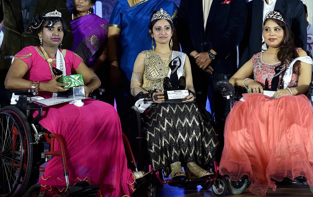 Miss Wheelchair India 2015 Winner Priya Bhargava(C) from Delhi flanked by 1st runner up Sunakshi Bawa(R) from Punjab and 2nd runner up Chaya Kashti(L) from Karnataka during the Miss Wheel Chair 2015 Beauty pageant for women with disability in Bengaluru.