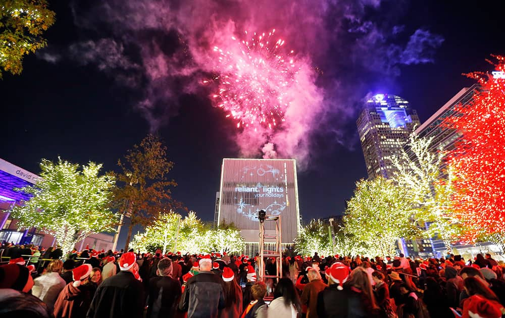 People enjoy fireworks and the dazzling display of more than 550,000 LED lights during the Reliant Lights Your Holidays at the AT&T Performing Arts Center in Dallas, TX.