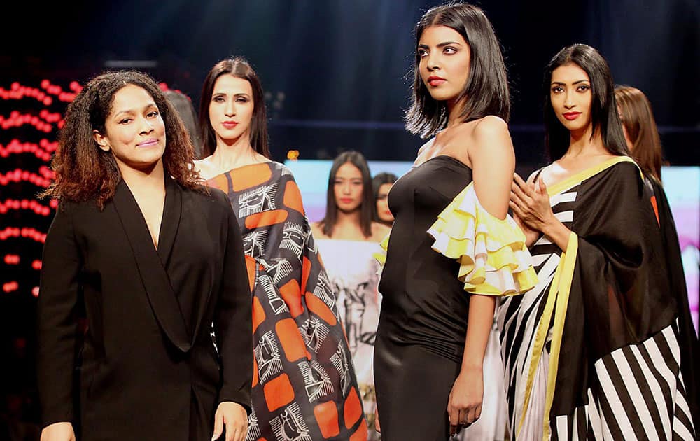 Models with fashion designer at the Blenders Pride Fashion Tour 2015, in Mumbai.