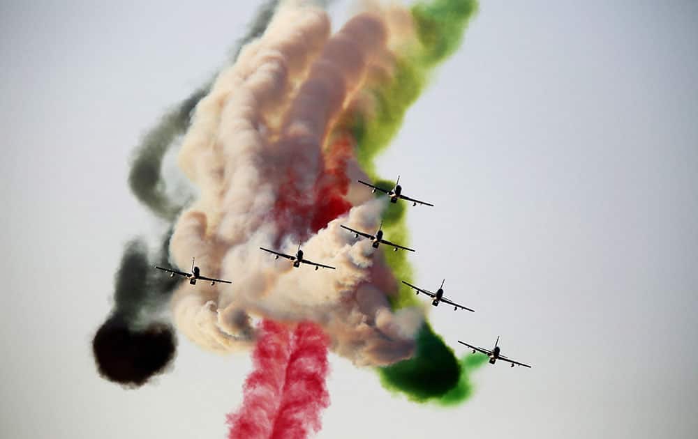 The Al Fursan aerobatic team of the United Arab Emirates air force performs a stunt at the World Air Games in Dubai, United Arab Emirates.
