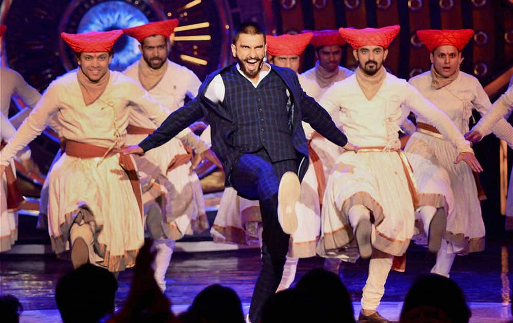 Actor Ranveer Singh performs during the promotion of his upcoming film Bajirao Mastani at a TV show in Mumbai.