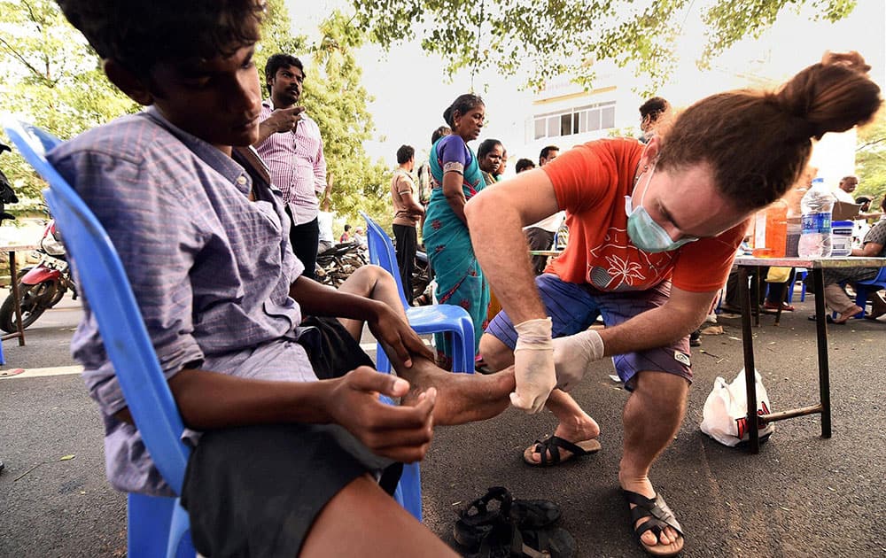 Flood affected people getting medical assistance at a medical camp in Kotturpuram, one of the worst flood-hit localities in Chennai.