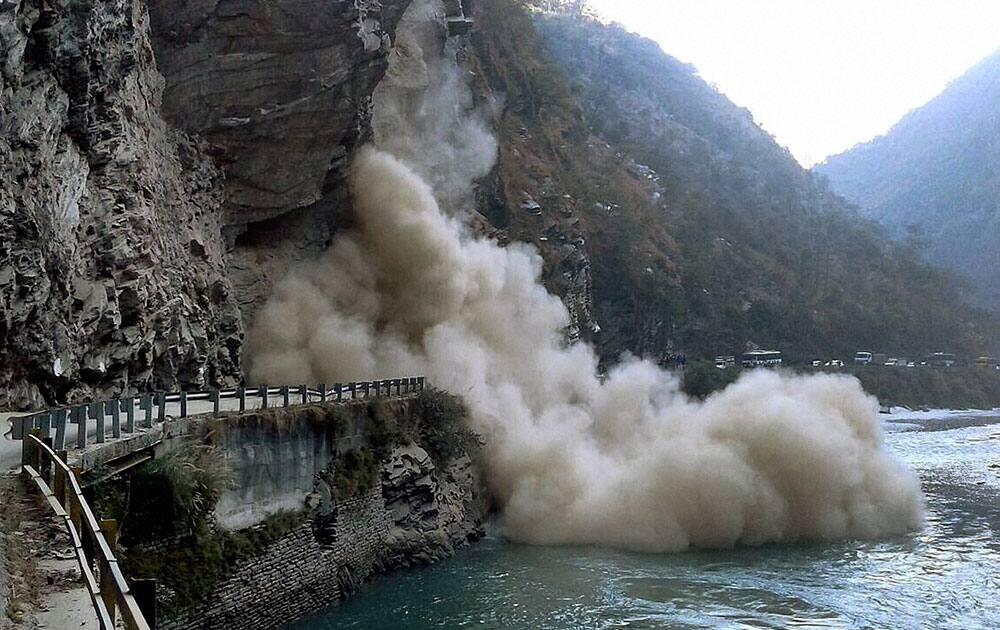 Debries falling in river Beas after a landslide at Rains Nala at Thalaut about 30 Km away from Mandi between Mandi Kullu road.