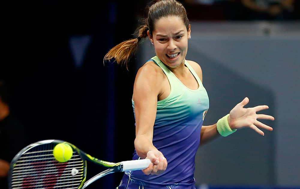 Serbias Ana Ivanovic of the UAE Royals returns a serve from Czech Republics Karolina Pliskova of the Singapore Slammers during their womens singles match in the International Premier Tennis Leagu.