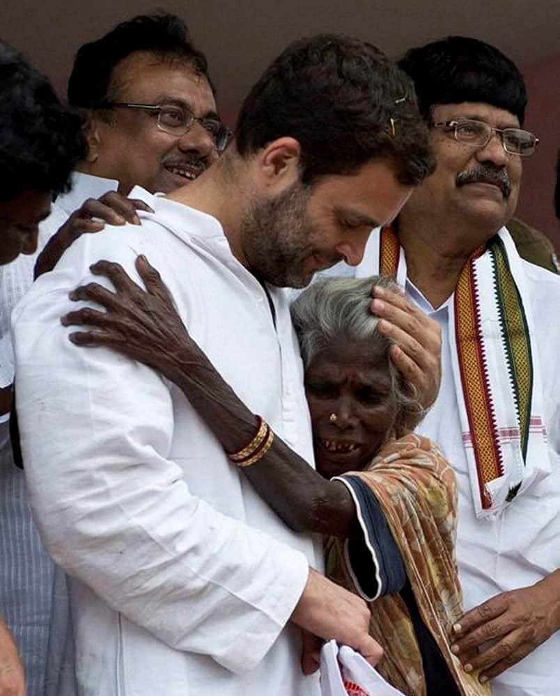 Congress Vice President Rahul Gandhi console an old woman during his visit to flood affected area in Cuddalore.