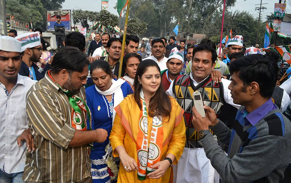 Actress and Congress leader Nagma along with party workers during a Padyatra in Meerut.