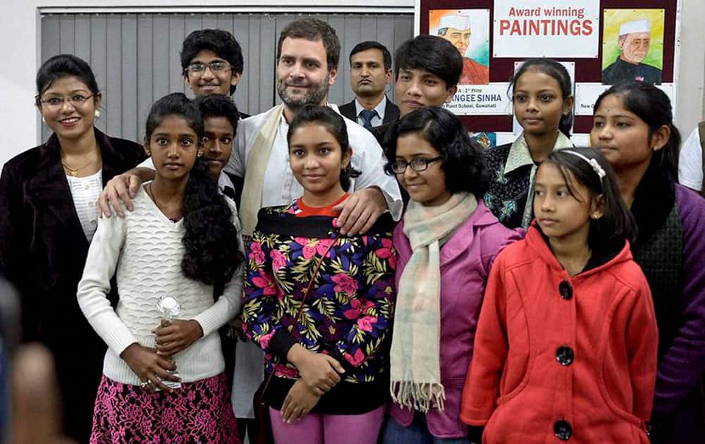 Congress Vice President Rahul Gandhi poses with students during his visit in Guwahati.