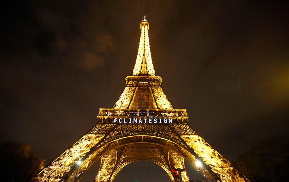 The slogan 'CLIMATESIGN' is projected on the Eiffel Tower as part of the COP21, United Nations Climate Change Conference in Paris, France.