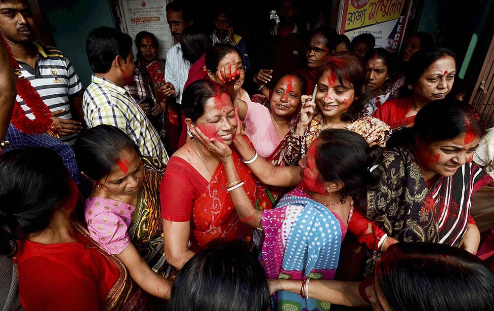 CPI(M) supporters celebrate their victory in civic polls in Dharmanagar, north Tripura.